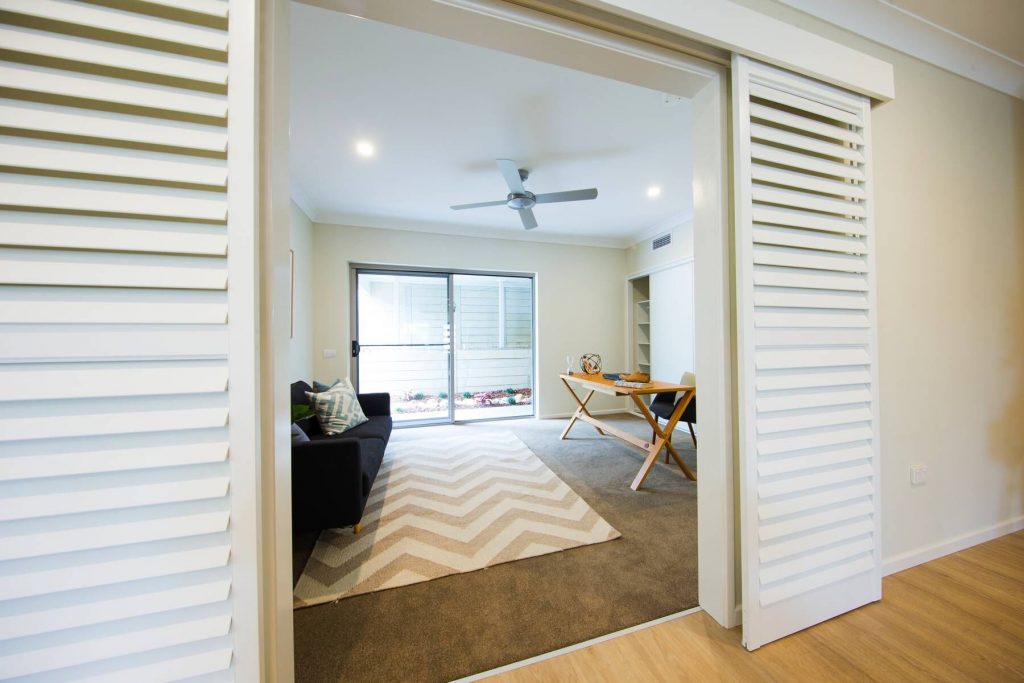 The Best Window Coverings for Rental Property Blog Featured Image Showing Interior Basswood Shutters