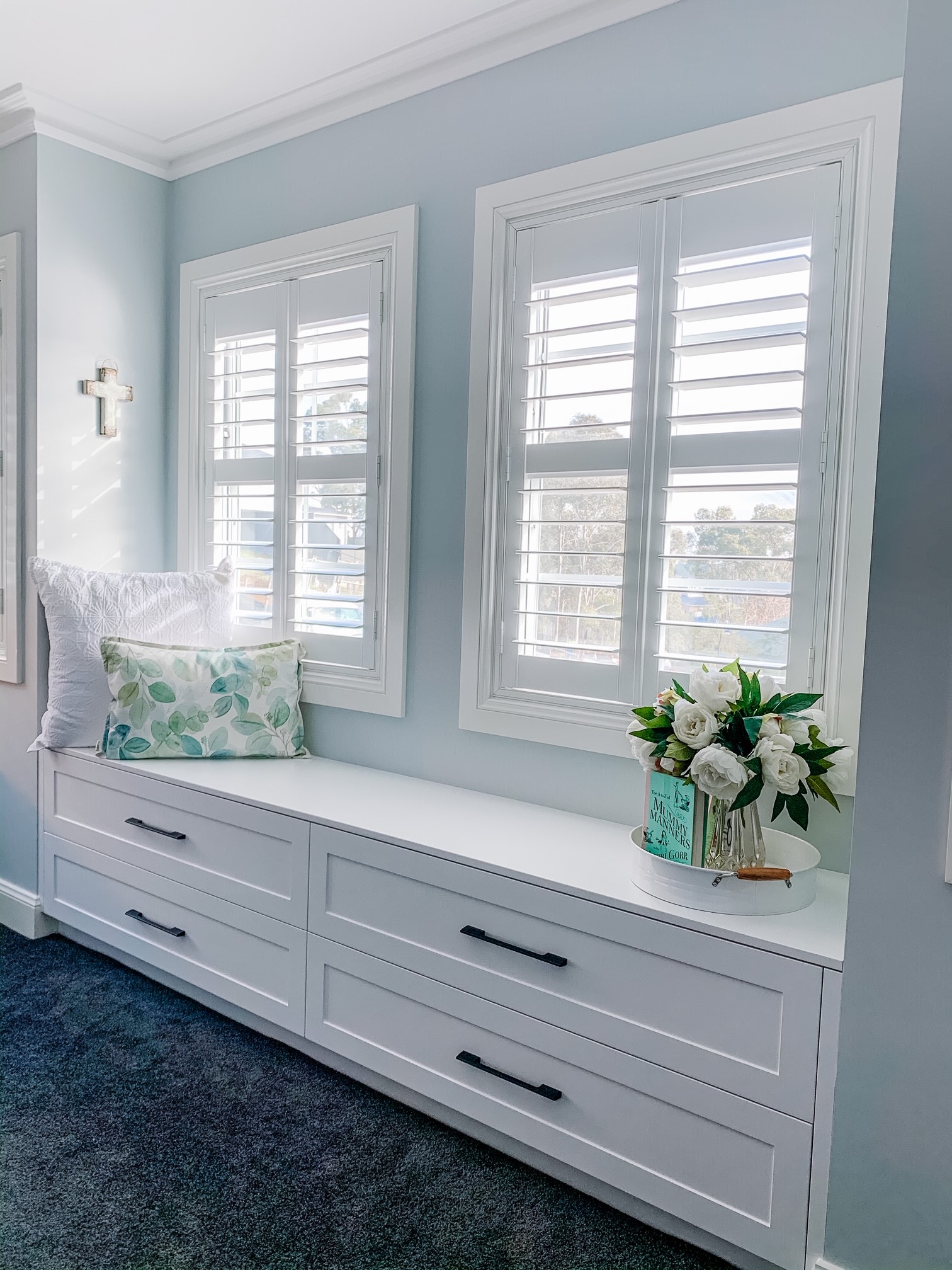 Plantation shutters in a dressing room - how to clean plantation shutters blog featured image