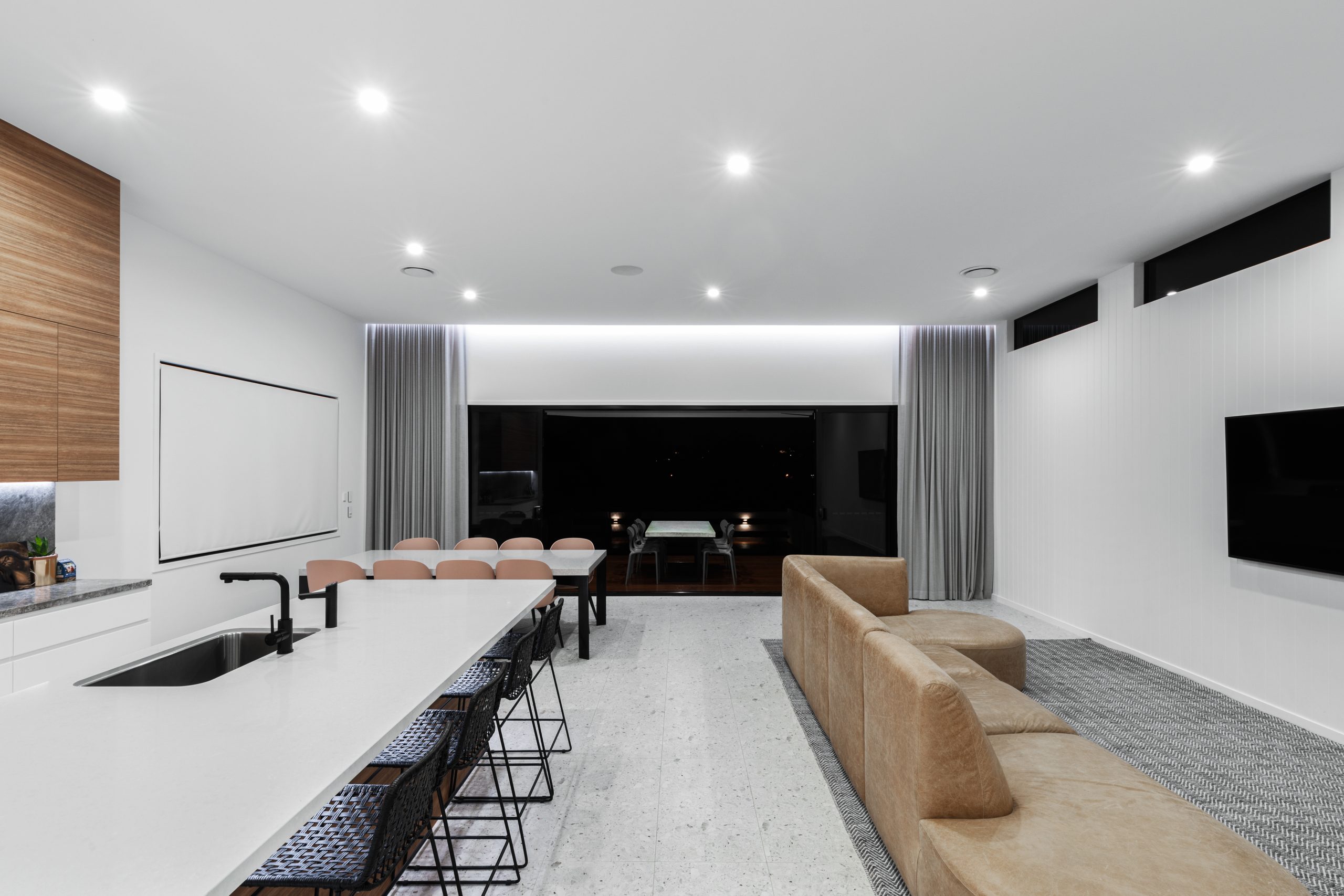 Interior View of Modern White Kitchen & Living Room | Featured Image for the Qualis Collaboration Blog from Blindo