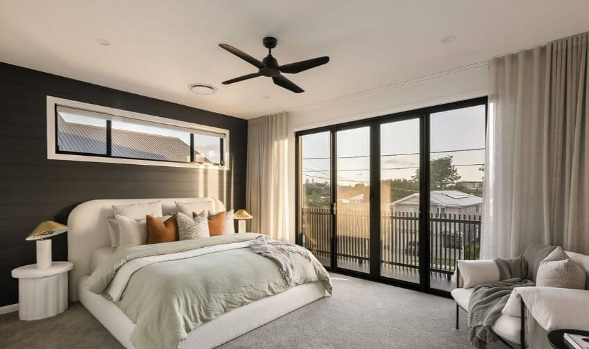 a master bedroom with large windows | Featured image for the blog Ways to Reduce Noise from Windows from Blindo.