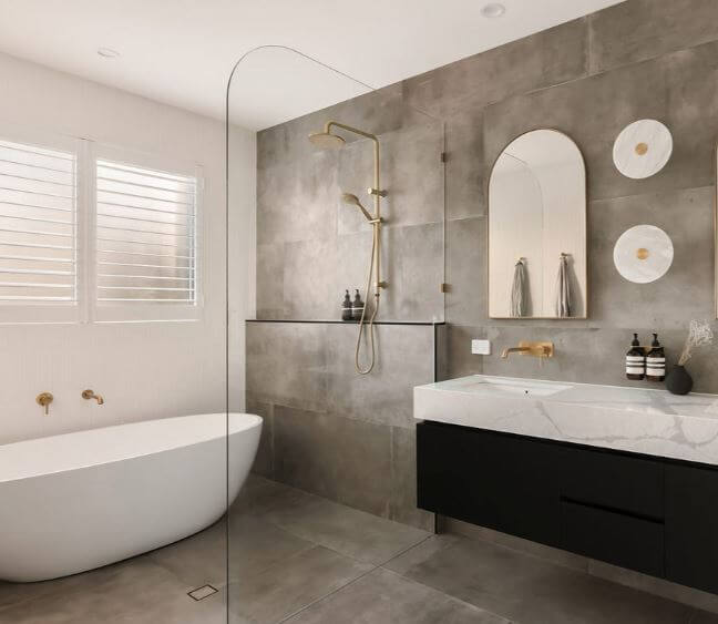 An elegant looking modern bathroom with a marble benchtop and gold faucets | Featured image for the Exploring the Best Waterproof Bathroom Shutters blog from Blindo.