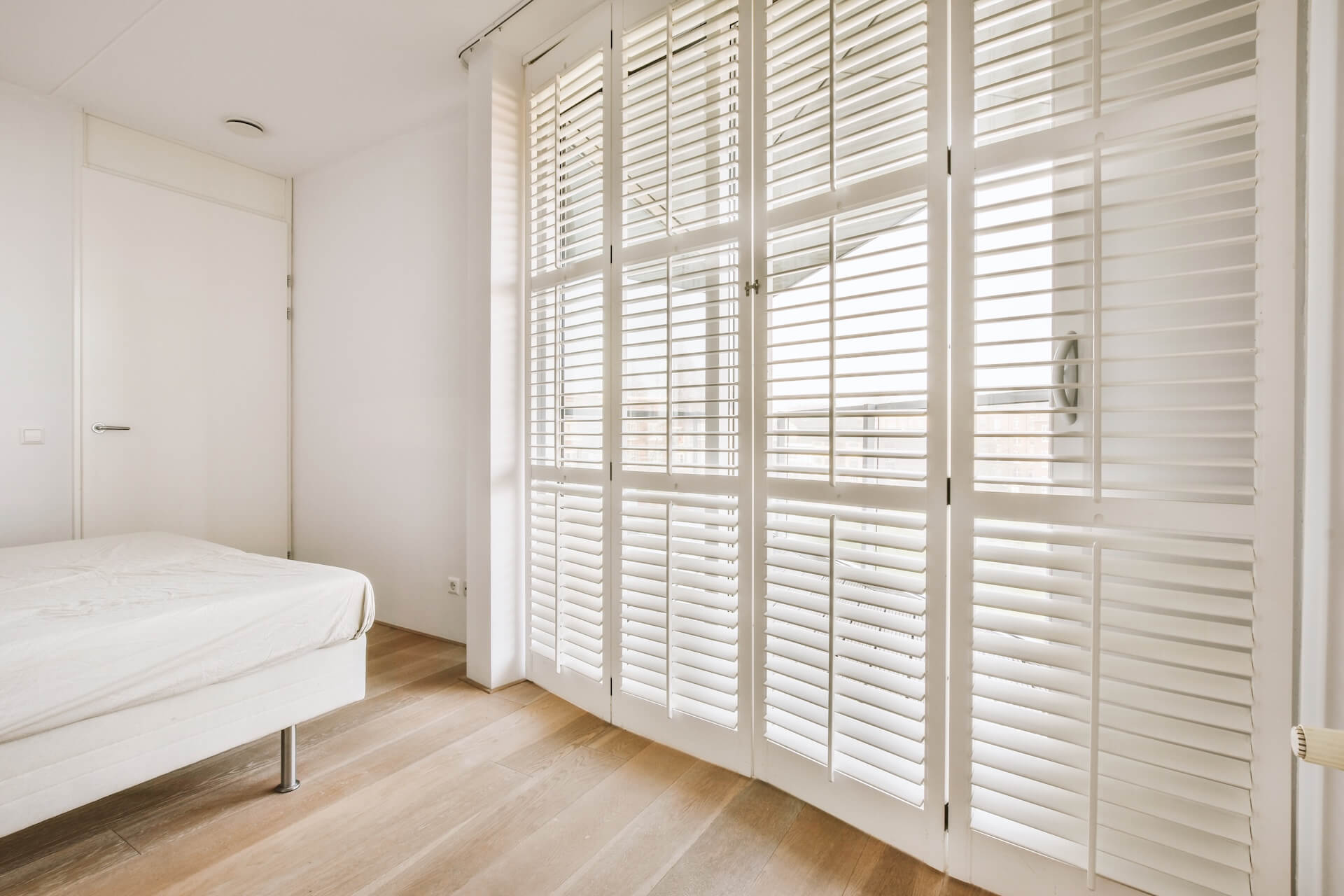 Weatherproof shutters in an apartment | Featured image for the Most Effective Weatherproof Shutters for Australia blog post from Blindo.